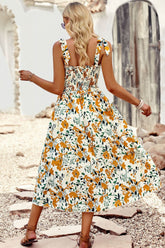 Robe imprimée à smocks et épaules nouées